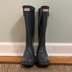 Grey tall Hunter boots.